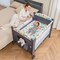 Honeyjoy 5-in-1 Baby Crib with Adjustable Height Soft Mattress Portable Pack Play with Music Black/Grey